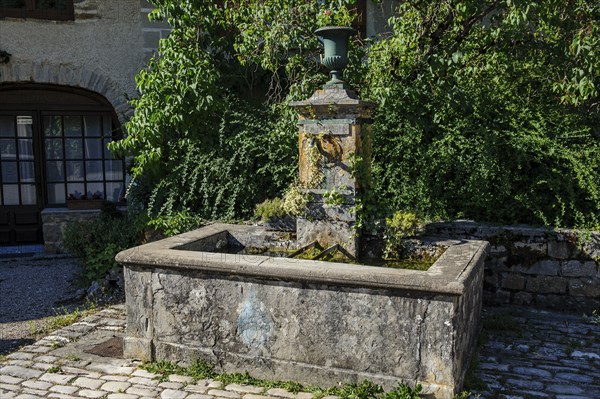 Old historic fountain with curved tap Water spout for permanent drinking water supply Clean