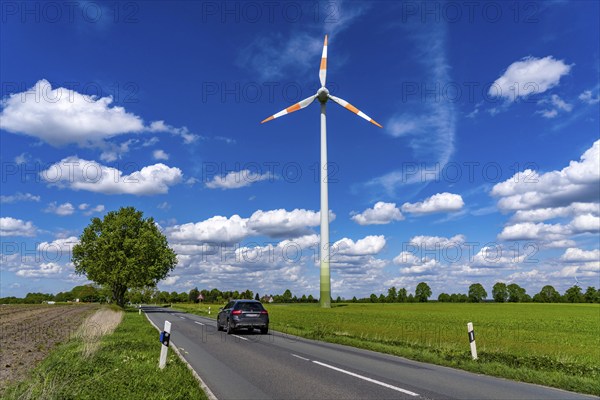 Wind turbine, wind energy plant from the manufacturer Enercon, blue sky with many white clouds,