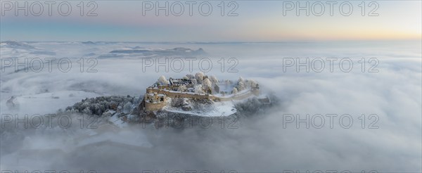 Aerial panorama of the Hegau volcano Hohentwiel with Germany's largest fortress ruins on a cold,