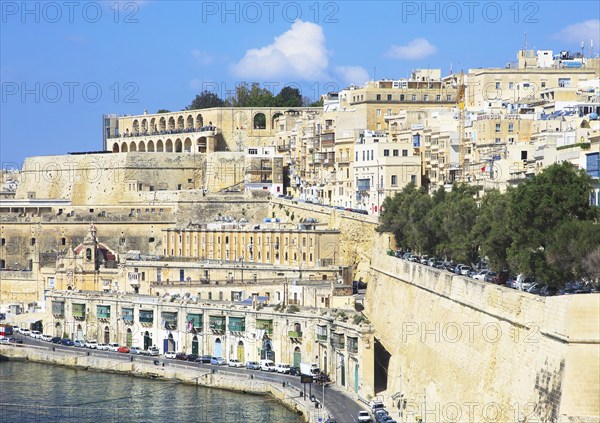Historic waterfront buildings on Grand Harbour waterside, Valletta, Malta, Europe