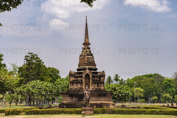 Buddha statue and chedi of the Buddhist temple Wat Sa Si, UNESCO World Heritage Sukhothai