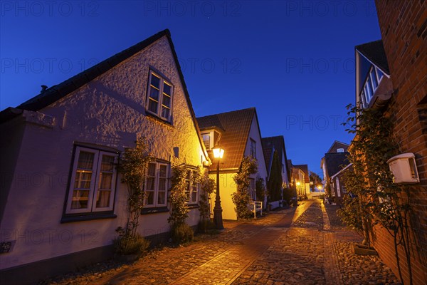 Alley in an old town, twilight, illuminated, Wyk auf Föhr, North Sea island Föhr,