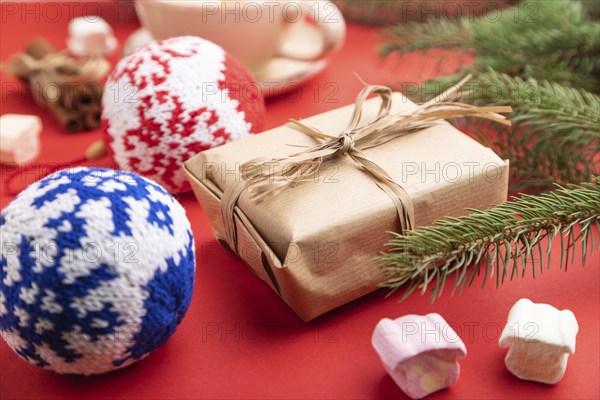 Christmas or New Year composition. Decorations, box, cinnamon, knitted balls, fir and spruce