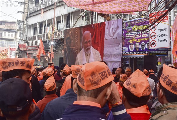 People watch live broadcast of the consecration ceremony of the Ram temple, in New Delhi, India on