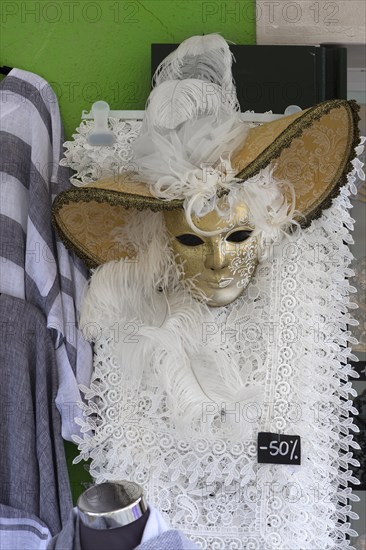 Venetian carnival costume in front of a shop, Burano, Veneto, Italy, Europe