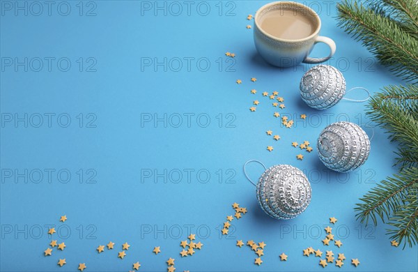 Christmas or New Year composition. Decorations, silver balls, fir and spruce branches, cup of