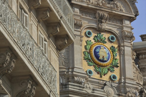 Villa with floral decorations, medallion and balcony railing, house, detail, coat of arms,