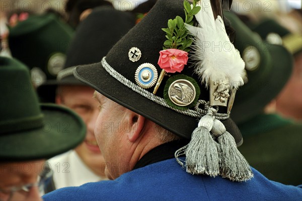 Man of a Bavarian shooting club from Chiemgau in traditional traditional costume, decorated hat