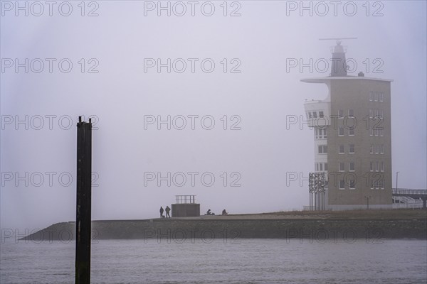 Thick fog in winter, hanging over the mouth of the Elbe into the North Sea, radar tower of the