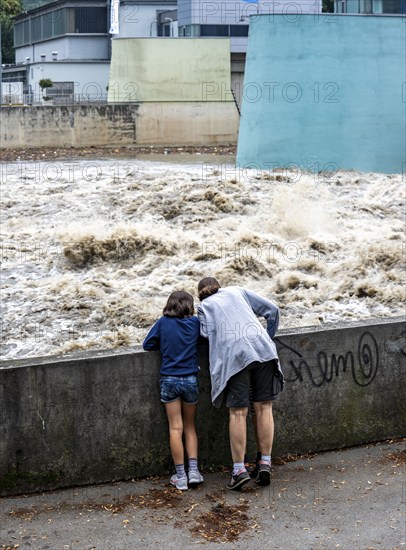 Weir of the Lake Baldeney in Essen, the masses of water roar through the open weirs, spectators,