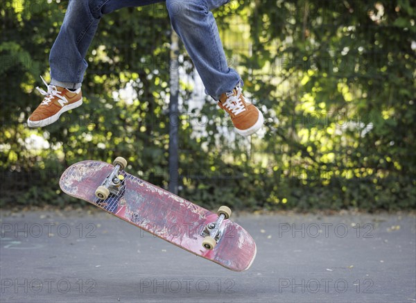 A person does a kickflip on a skateboard in Berlin, 16/08/2024