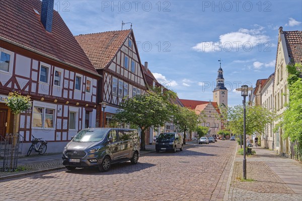 Residential and commercial buildings in Rudolf-Breitscheid-Straße, paved with cobblestones, in the
