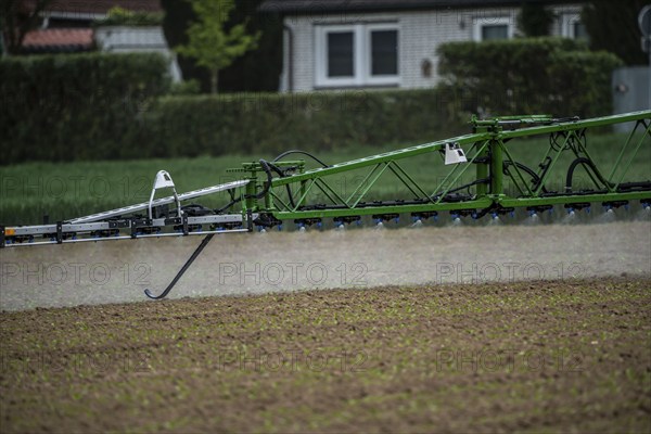 Agriculture, pesticide being sprayed on a field, sugar beet seedlings, North Rhine-Westphalia,