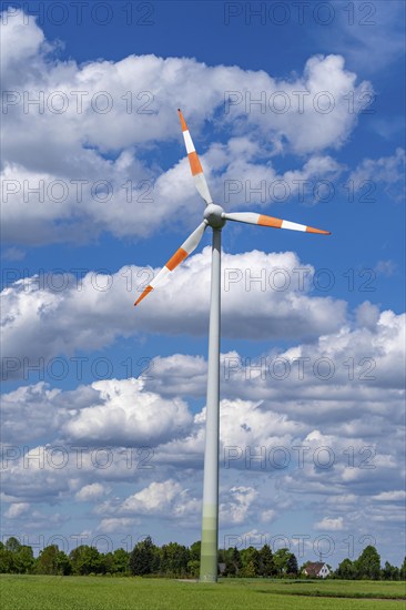 Wind turbine, wind energy plant from the manufacturer Enercon, blue sky with many white clouds,