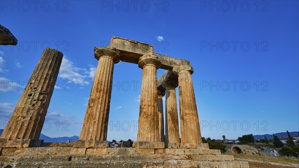 Archaic Temple of Apollo, Doric columns, The majestic ruins of an ancient temple under a clear blue