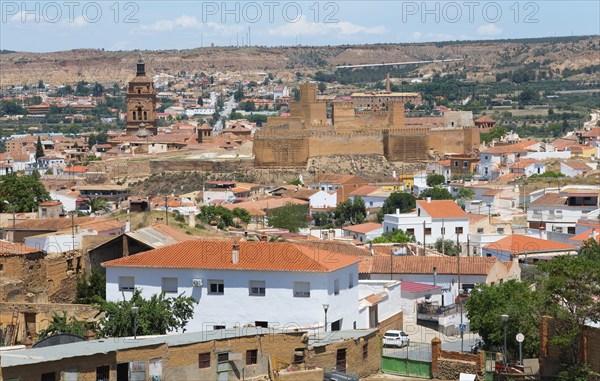 Panoramic view of a historic city with an old fortress, red roofs and arid surroundings, Cathedral,