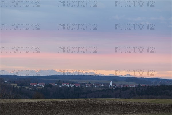 Alpine panorama near Magolsheim. Säntis, Swiss Alps at sunset with a view of Mehrstetten. View from