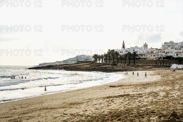 Village by the sea and beach, Luz, near Lagos, Algarve, Portugal, Europe