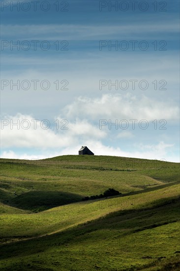 Isolated farm called buron on the Cezallier plateau in the Auvergne Volcanoes Regional Natural
