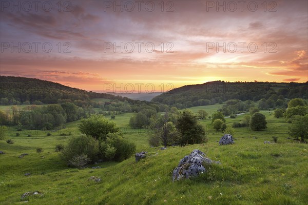 Randecker Maar on the Swabian Alb. Beautiful sunrise with the Drei Kaiser mountains in the distance