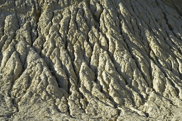 Gullies in soft rock of cliff caused by rain water erosion