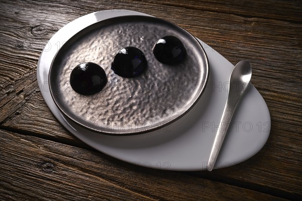 Molecular cuisine concept spheritions black jelly texture
