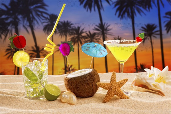 Beach cocktail sunset on palm tree sand mojito margarita coconut