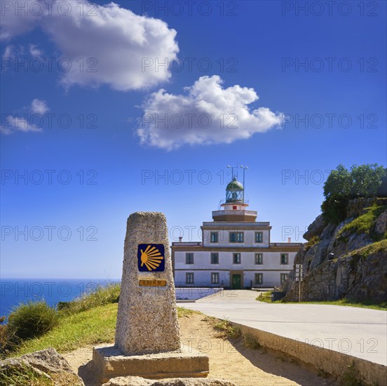 End of Saint James Way sign and lighthouse of Finisterre in Galicia Spain photomount