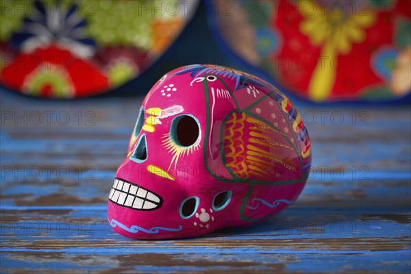 Mexican pink skull dia muertos crafts in Mexico of deaths day