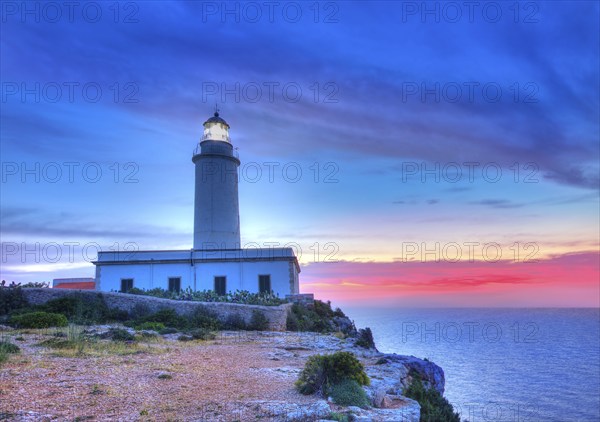 La Mola Cape Lighthouse Formentera at sunrise in Balearic Islands