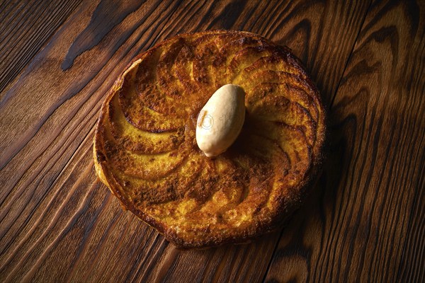 Apple tatin pie cake on puff pastry dessert and ice cream on top