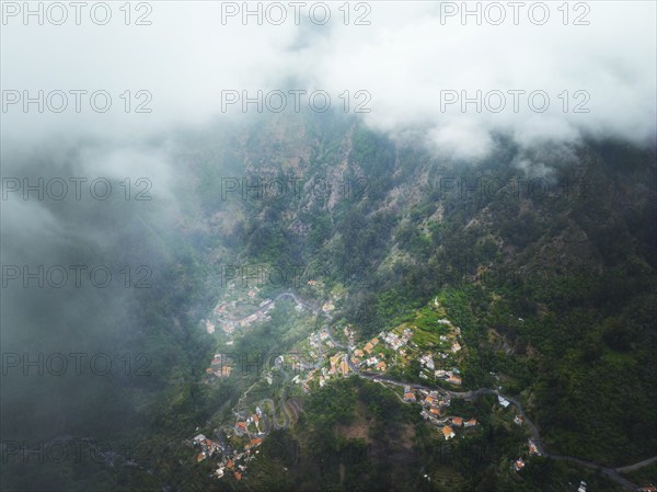 Aerial drone view of Curral das Freiras village in Valley of the Nuns from Miradouro da Eira do