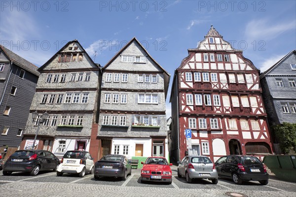 Restored and not yet restored houses, Kornmarkt grain market, historic old town of Herborn, Hesse,