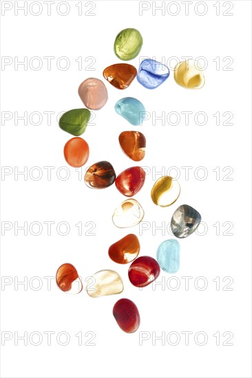 Colorful stones over white with dollar symbol shape