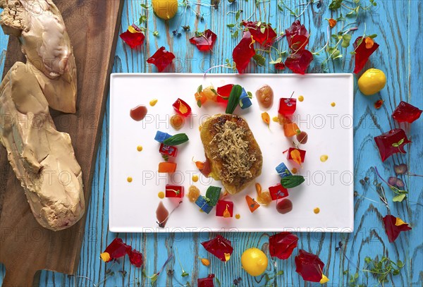 Foie slice with grated white truffle and colorful jelly decoration