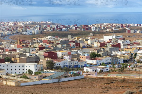 Oblique view over coastal town to Atlantic Ocean, Mirleft, southern Morocco, North Africa