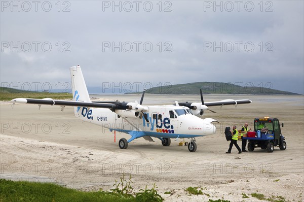 Flybe plane on sandy airstrip Isle of Barra airport, Barra, Outer Hebrides, Scotland, UK