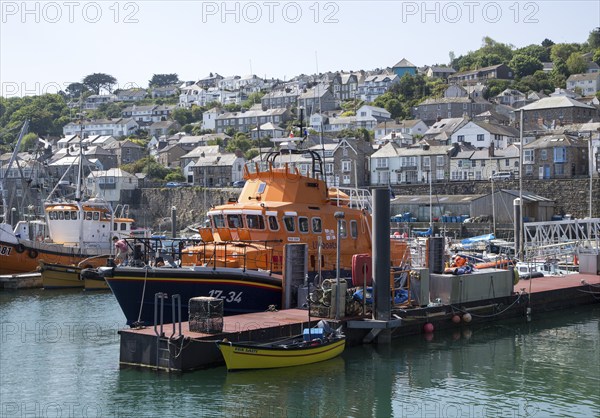 RNLI lifeboat in the harbour of fishing port of Newlyn, Cornwall, England, UK