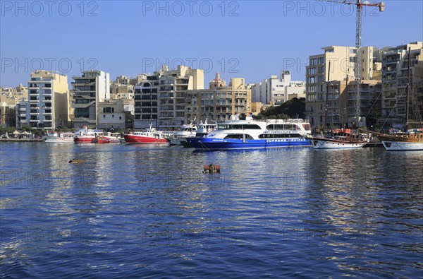 Tour boats on waterfront quay at Sliema, Valletta, Malta, Europe