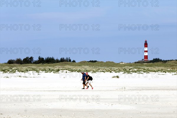 Holidaymakers on the beach of the island of Amrum, behind the lighthouse, Wittdün, 18.06.2020