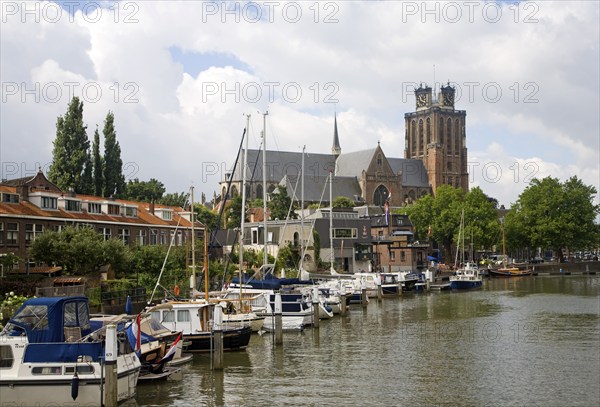 Grote Kerk cathedral church and boats in Nieuwe Haven, Dordrecht, Netherlands