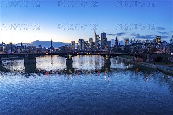 Skyline of the city centre of Frankfurt am Main, river Main, dusk, Ignatz-Bubis-Brücke, Hesse,