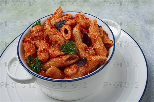 Penne pasta, with shrimp in tomato sauce, close-up, no people