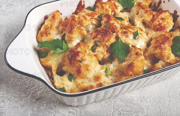 Baked cauliflower, in cream sauce, with cheese and spices, homemade, no people
