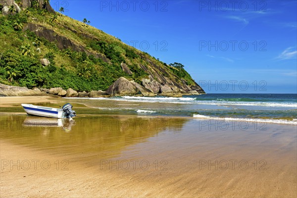 Speedboat on the sand of Bonete beach on the island of Ilhabela on the coast of Sao Paulo,