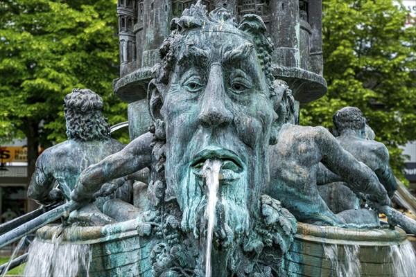 Detail of the historical column of the fountain on Josef-Görres-Platz in the historic centre of