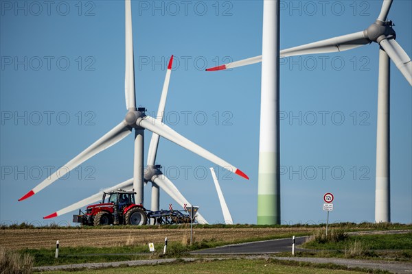 Wind farm near Lichtenau, wind turbines, country road, Driburger Straße, tractor at work in the