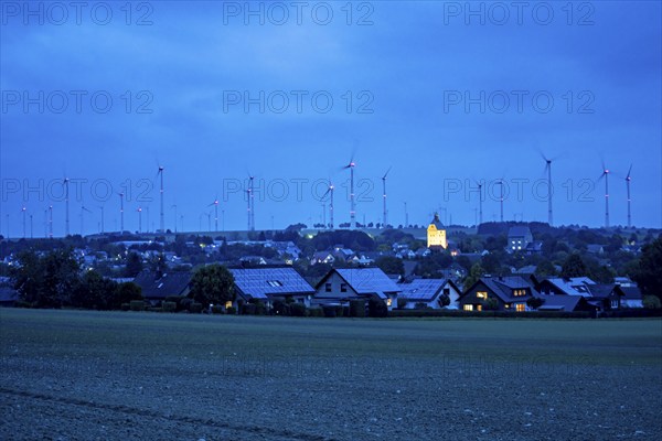 Wind farm above the village of Lichtenau, self-proclaimed energy town, houses with photovoltaic