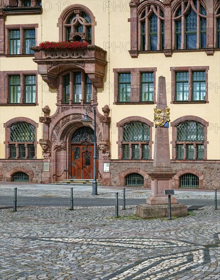 Portal of the Waldheim town hall in Art Nouveau style and Kursächsische Postmeilensäule, distance