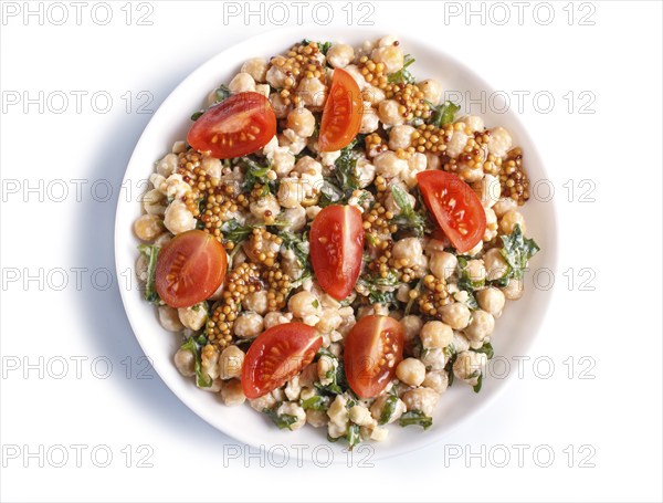 Vegetarian salad of boiled chickpeas, cheese, arugula, mustard and cherry tomatoes isolated on